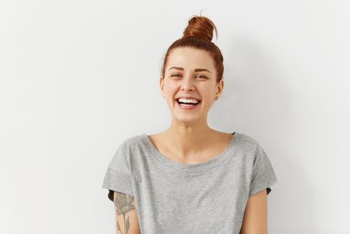 Happy,Cheerful,Young,Woman,Wearing,Her,Red,Hair,In,Bun